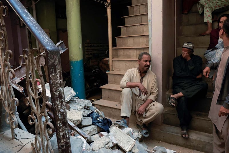 At least 13 killed in Karachi building collapse after blast, police say