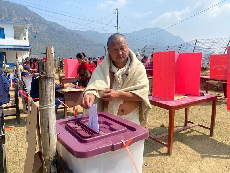 Mourner Casts Ballot in Baglung While Observing Funeral Rites