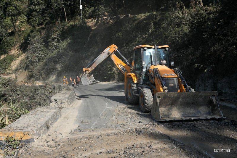 Traffic Police Manually Install Warning Signs on Dhading Highway Section Amid Safety Lapses