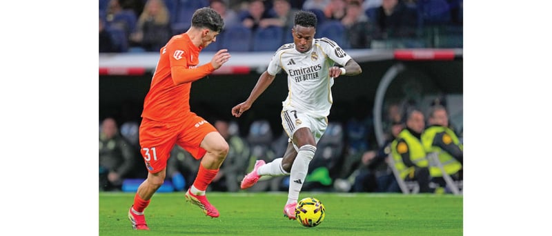 Vincius brace sends Real Madrid top