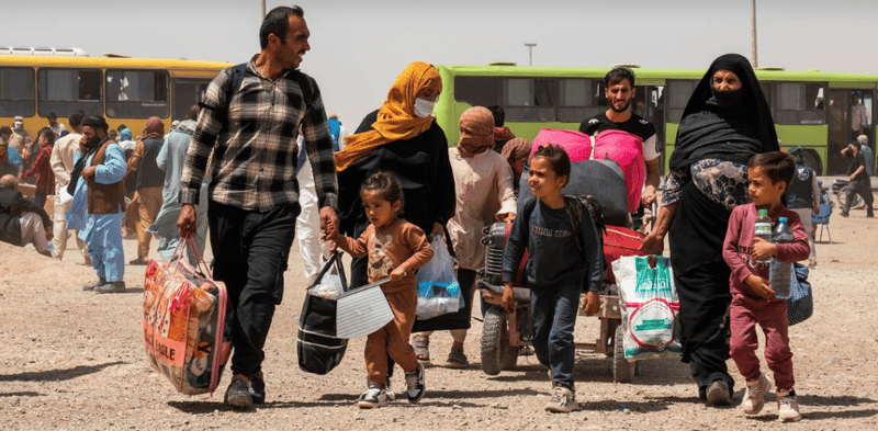 An Afghan family returns home from Iran after crossing the Islam Qala border in Afghanistan's Herat province in July 2025. © UNHCR/Oxygen Empire Media Production