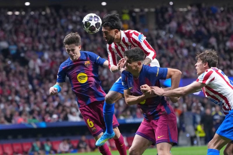 Atletico Madrid withstands Barcelona's early blitz to reach the Champions League semifinals